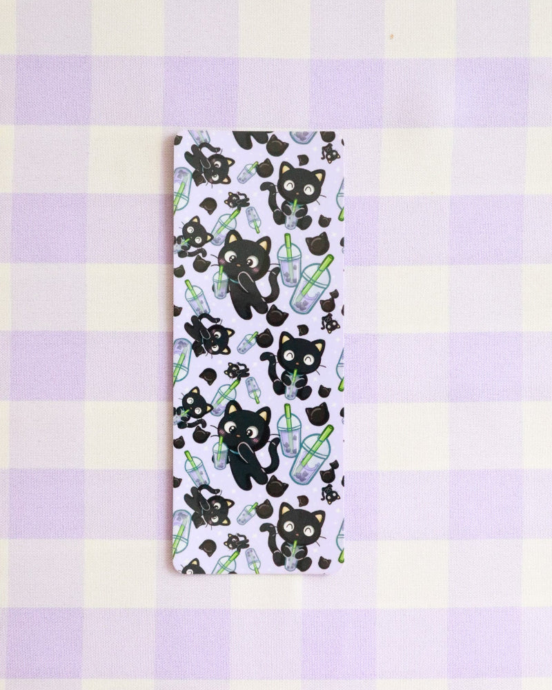 Phone case with black bear and bottle design on a purple and yellow checkered background