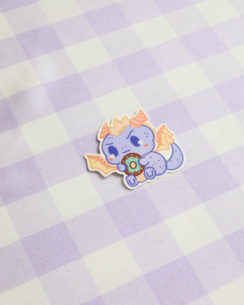 Cartoon character sticker on a checkered background