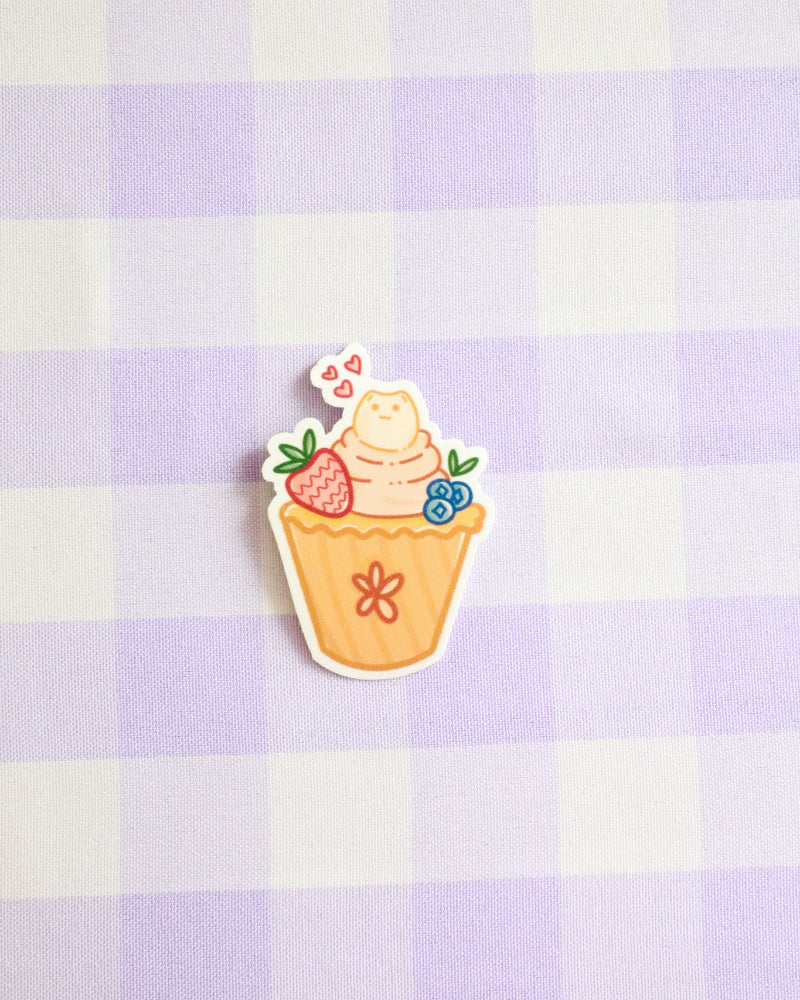 Sticker of a ice cream cone with flowers on a purple checkered background