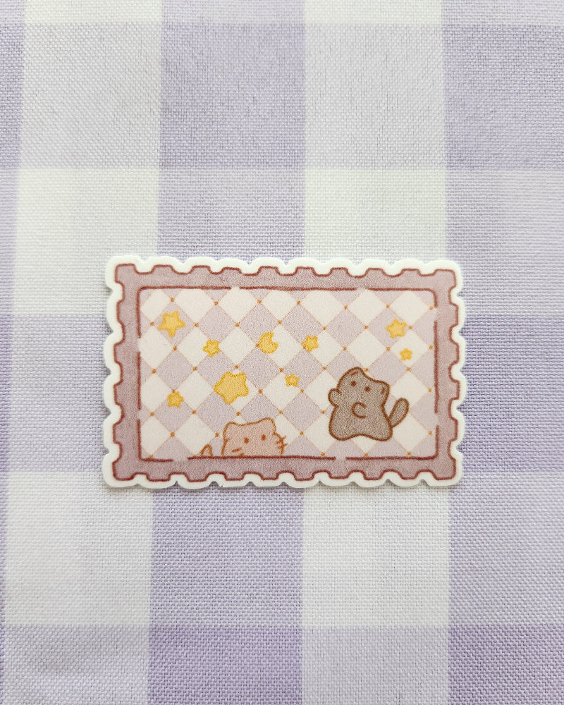 Decorative sticker with cartoon characters on a checkered fabric background