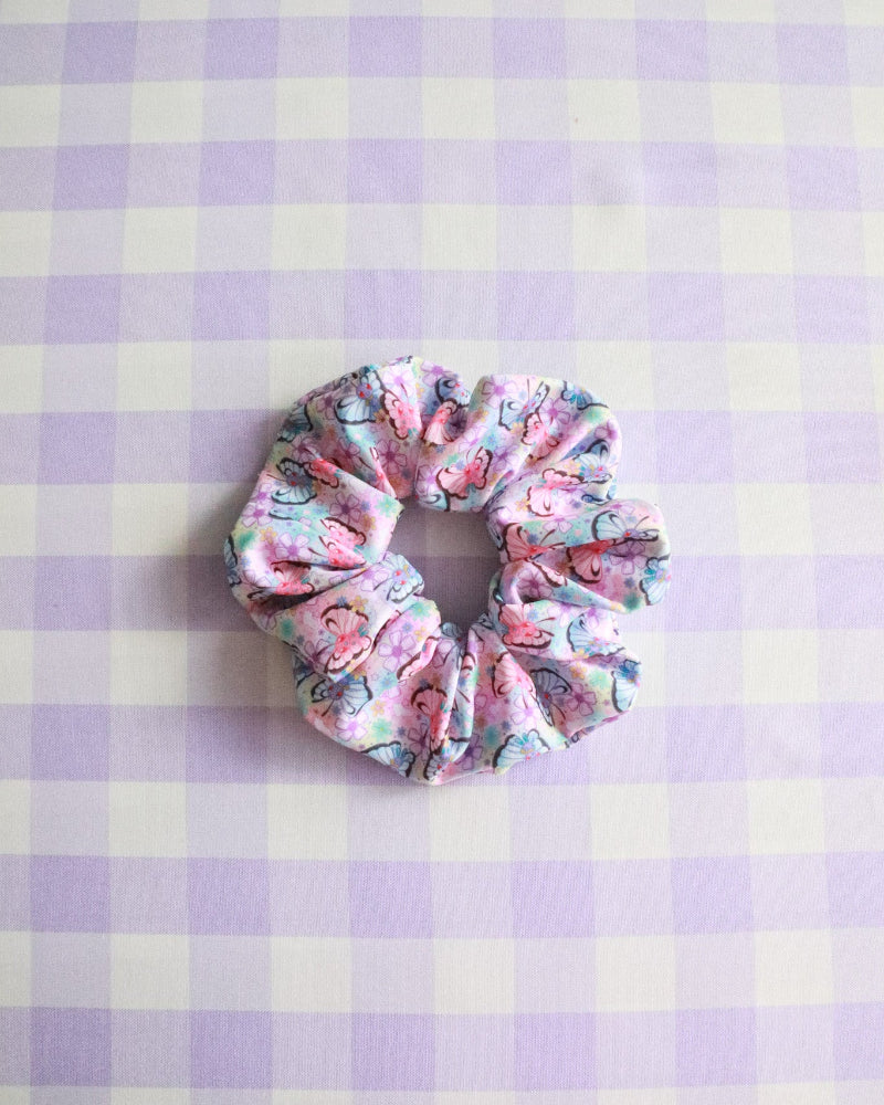 Floral scrunchie on a purple and white checkered background