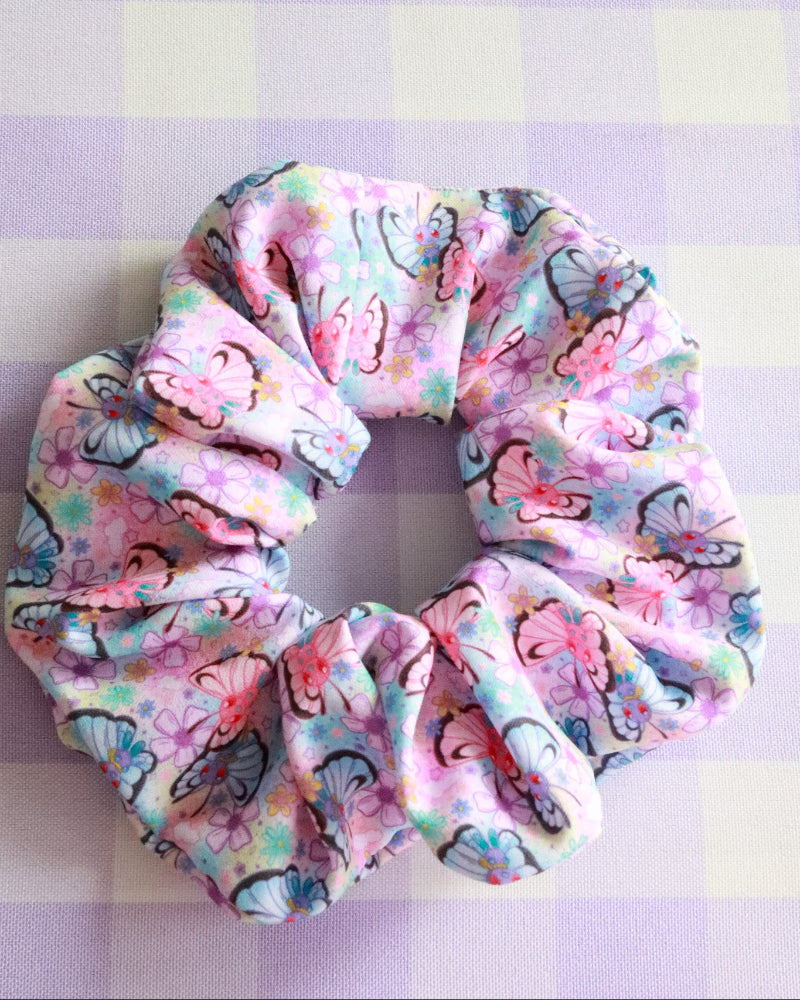 Colorful scrunchie with butterfly pattern on a checkered background