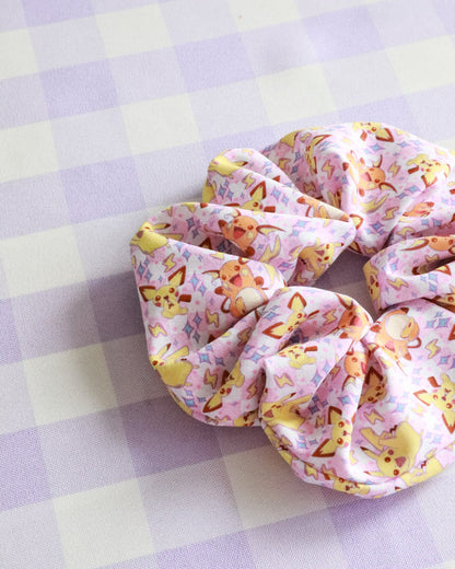 Scrunchie with cartoon character design on a checkered background