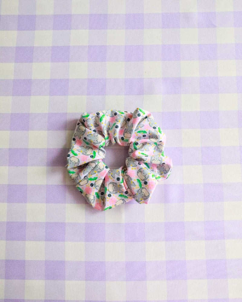 Scrunchie on a purple and white checkered background
