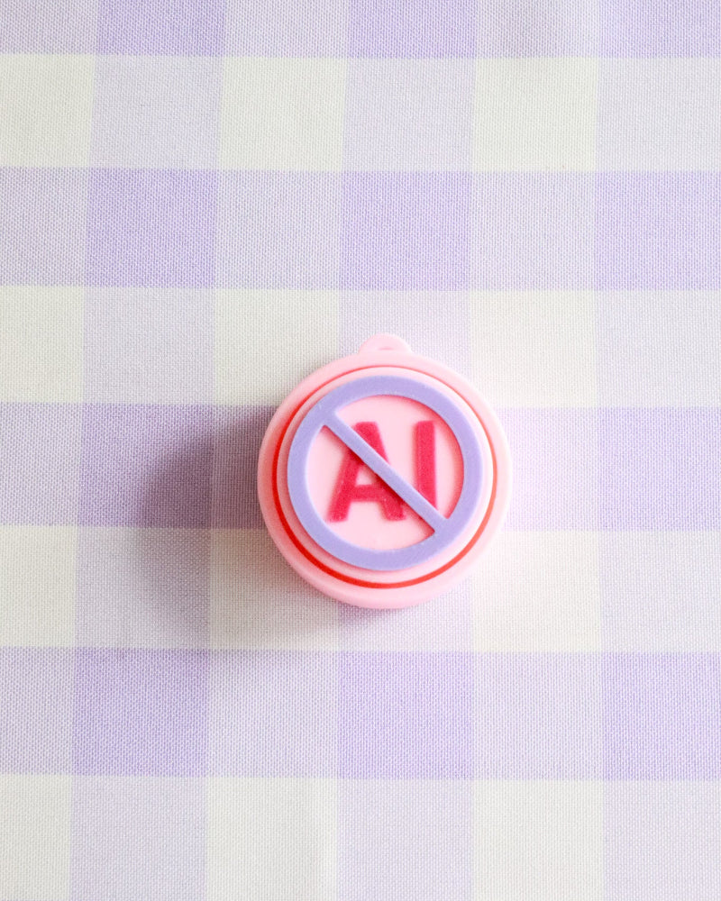 Button with 'No AI' symbol on a checkered background
