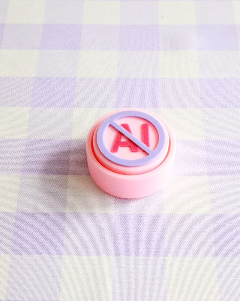 Pink button with a red circle and line symbol on a checkered background