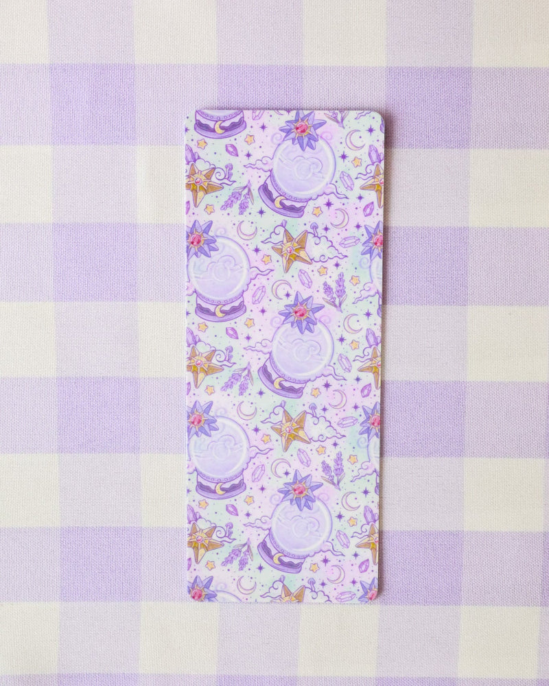 Decorative mat with floral and teapot design on a checkered background