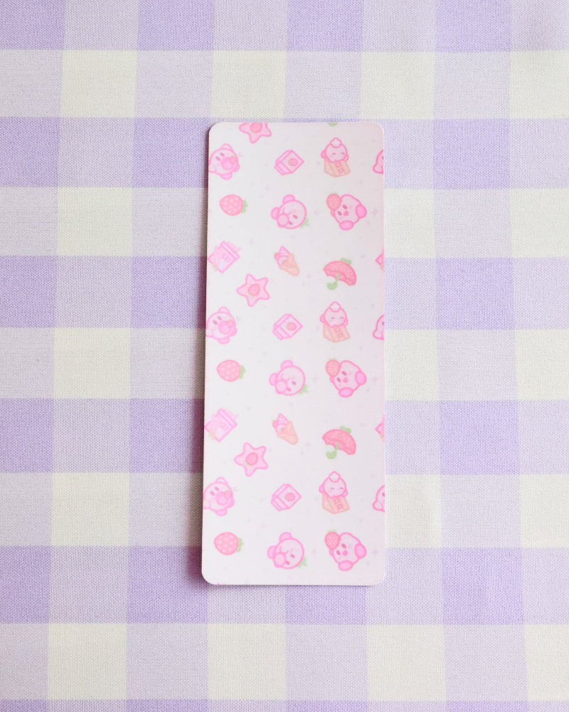 Small rectangular card with floral pattern on a purple and white checkered background