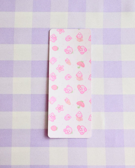 Small rectangular card with floral pattern on a purple and white checkered background