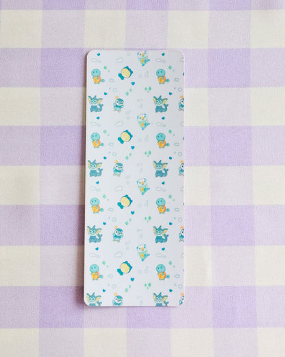 Sheet with cartoon designs on a purple and yellow checkered background