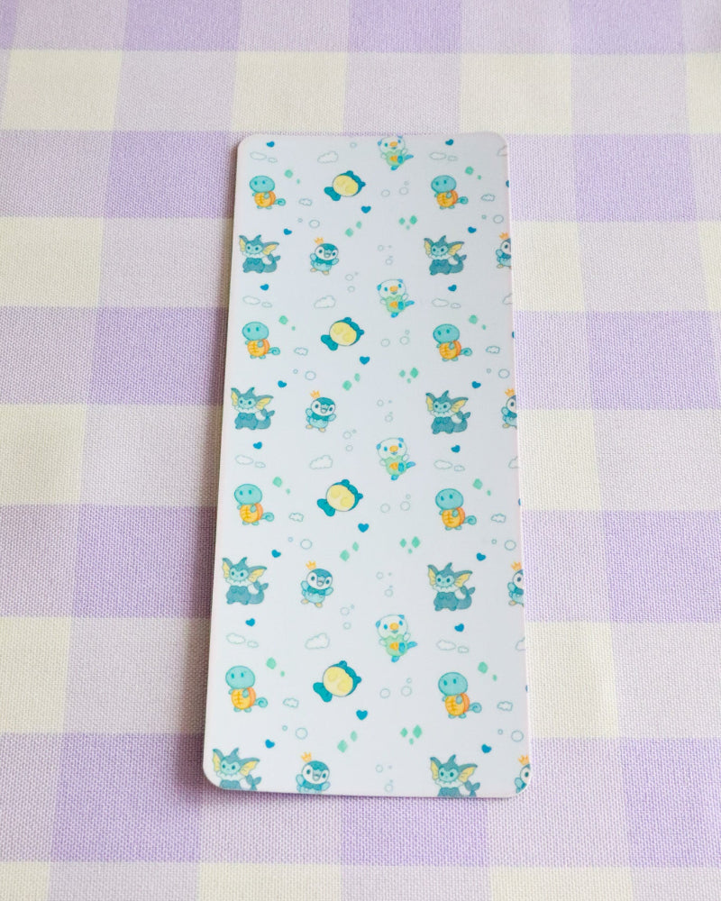 Children's diaper changing pad with cartoon design on a checkered fabric background