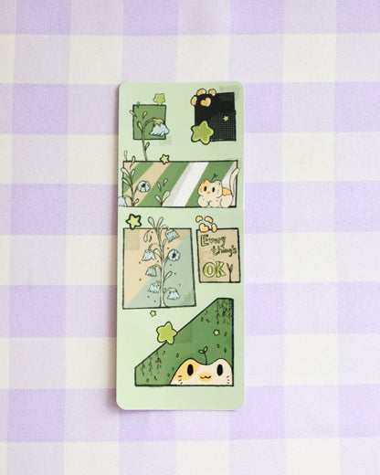 Set of cartoon-themed bookmarks on a purple and white checkered background