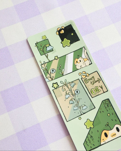 Sticker sheet with cute green characters on a purple and white checkered background