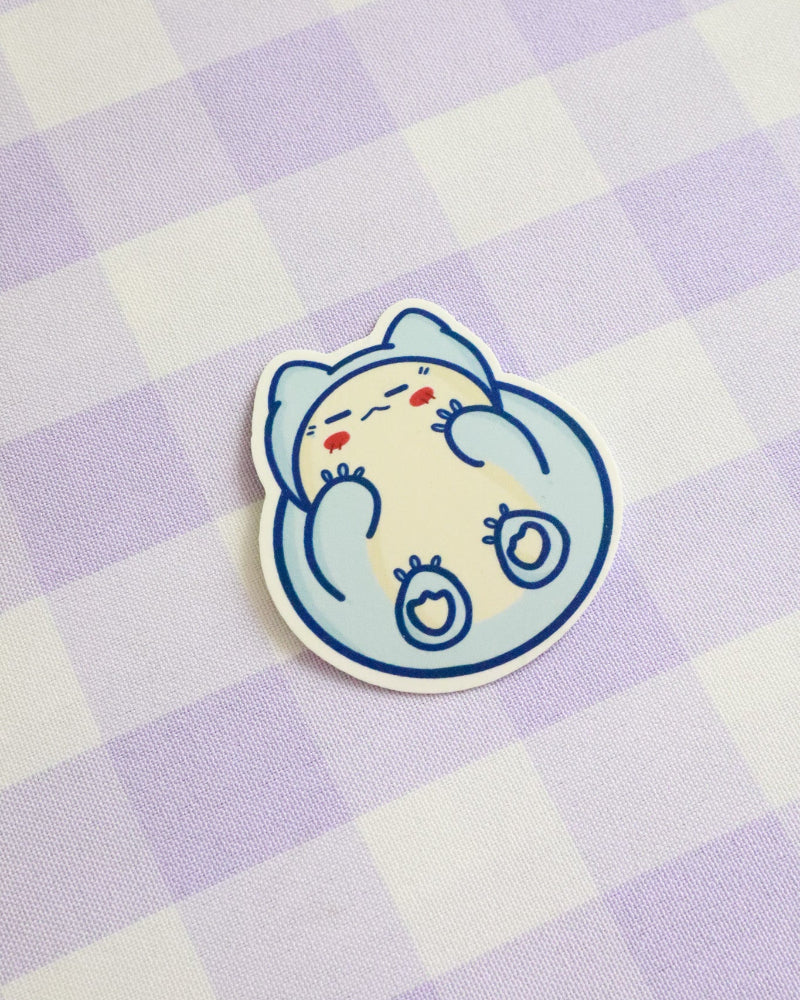 Cartoon character sticker on a purple and white checkered background