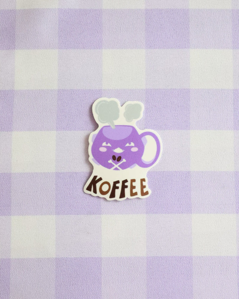 Sticker of a purple coffee mug with a face on a purple and white checkered background