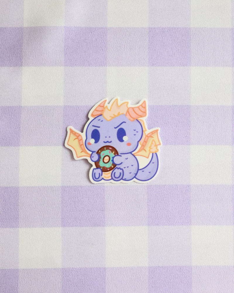 Cartoon character sticker on a purple and white checkered background