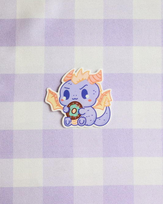 Cartoon character sticker on a purple and white checkered background