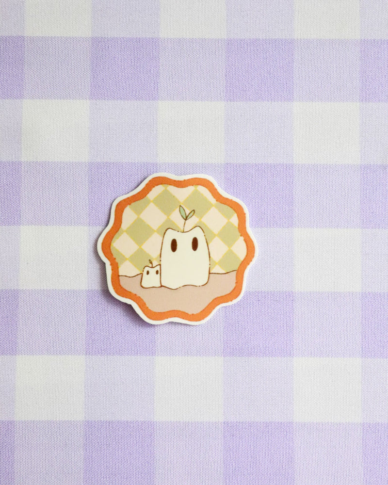 Sticker with a cartoon character on a purple and white checkered background