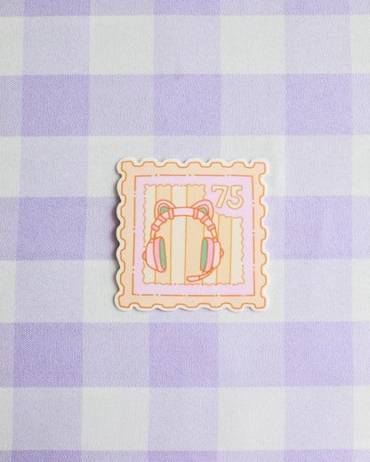 Decorative stamp with cartoon character on a purple and white checkered background