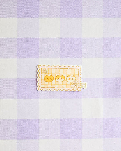 Checkered pattern with a cartoon character sticker in the center