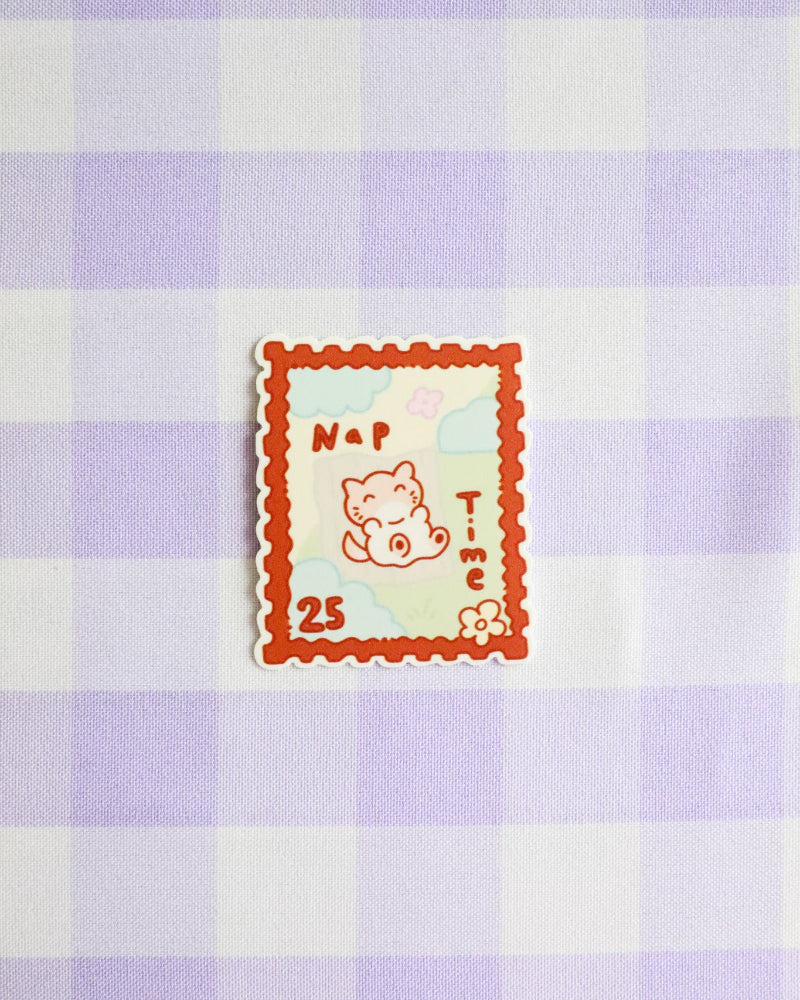 Checkered fabric with a cartoon cat design and text on a purple and white checkered background