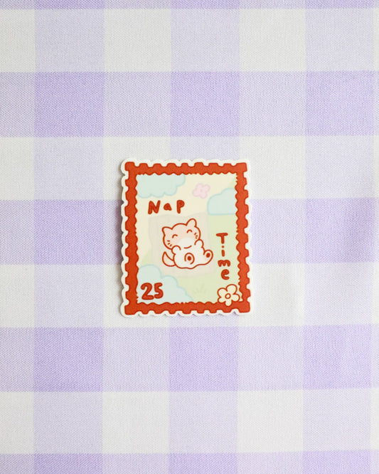 Checkered fabric with a cartoon cat design and text on a purple and white checkered background