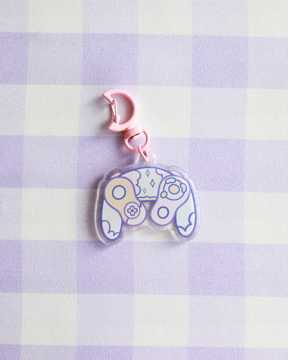 Decorative keychain with paisley pattern on a purple and white checkered background