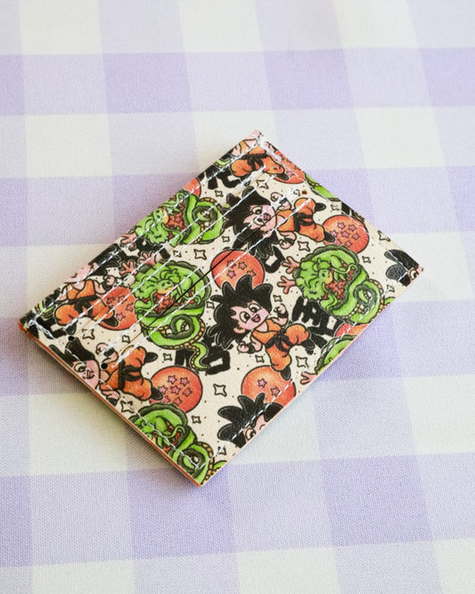 Notebook with Halloween-themed design on a purple and white checkered background