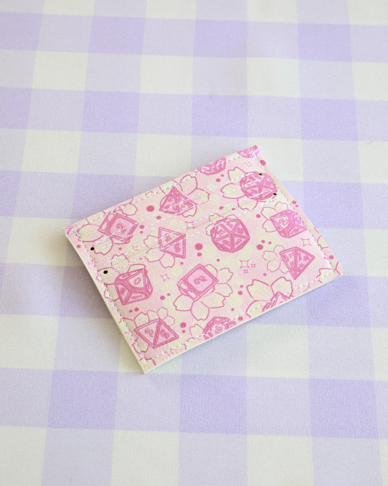 Pink notebook with cartoon designs on a checkered background