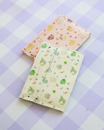 Two patterned notebooks on a checkered fabric background