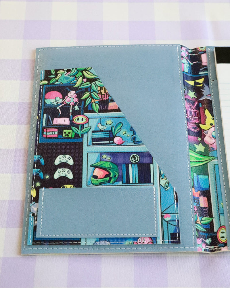 Colorful notebook with a cartoon design on a checkered background