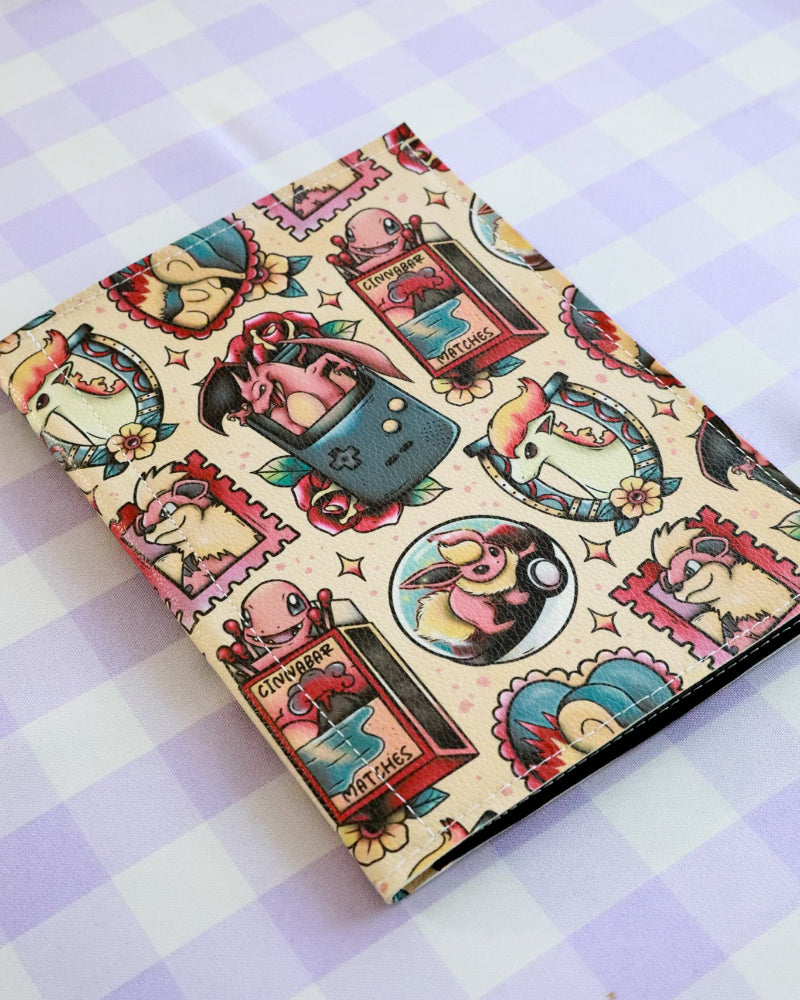 Notebook with vintage-style illustrations on a checkered background