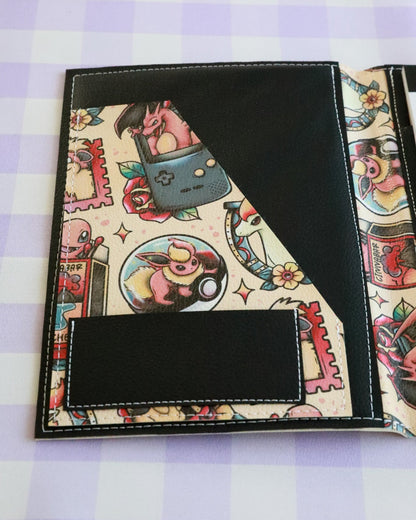 Colorful notebook cover with cartoon characters on a checkered background