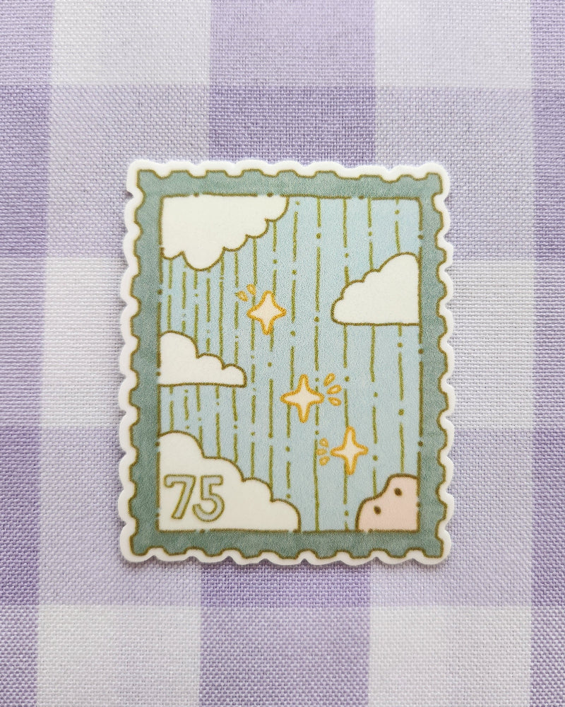 Decorative stamp design on a purple checkered fabric background