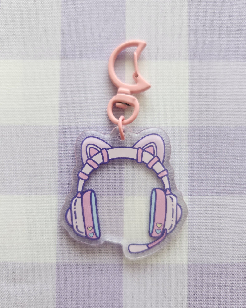 Keychain with cat ear design on a checkered fabric background