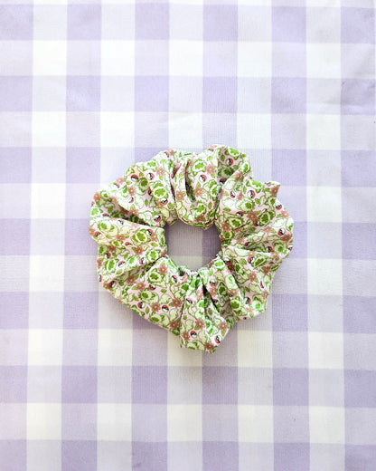 Floral scrunchie on a purple and white checkered background