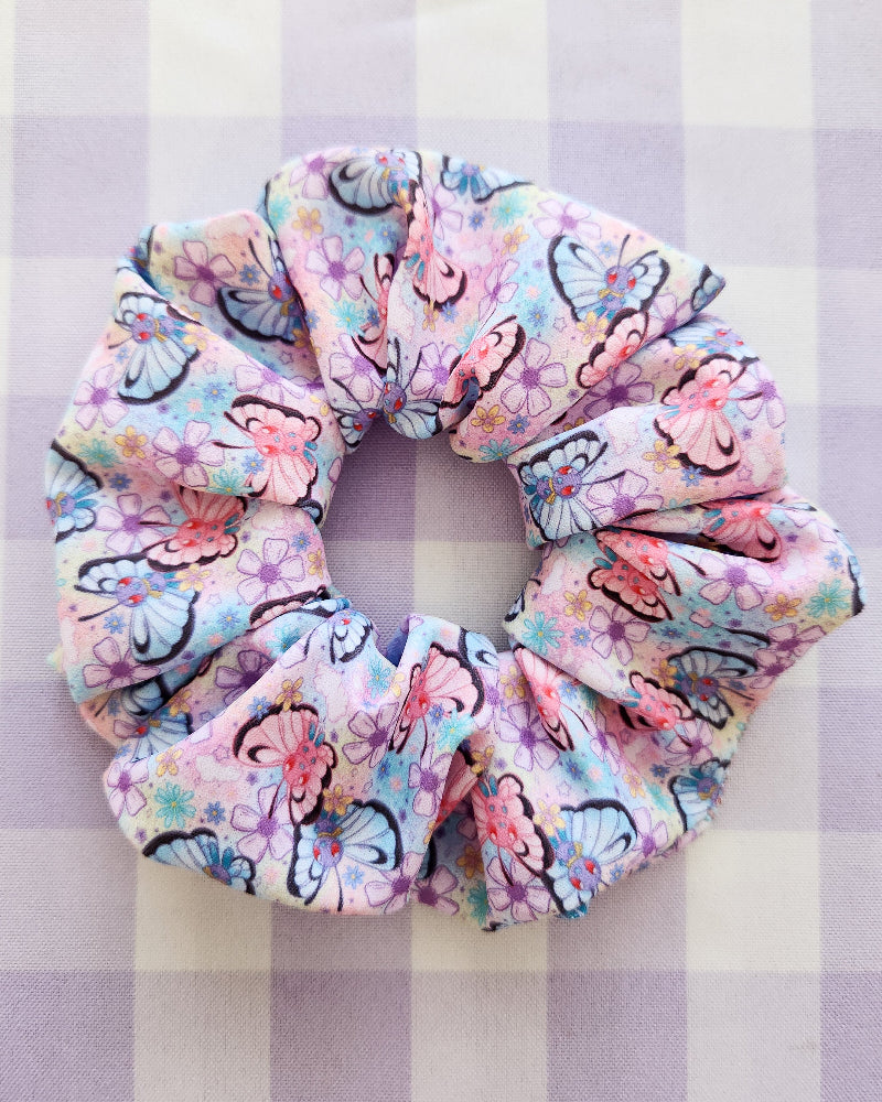 Floral scrunchie on a purple and white checkered background