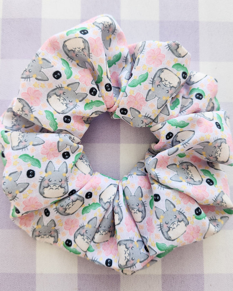 Scrunchie with cartoon cat pattern on a checkered background