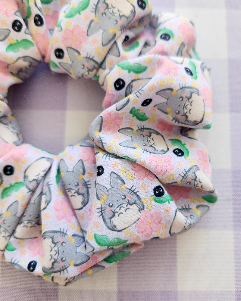 Scrunchie with cartoon cat pattern on a checkered background